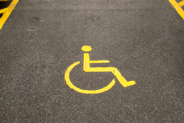 Yellow line cripple sign on park car outdoor