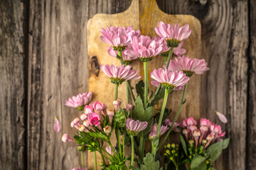 Pink flowers on the wooden board horizontal