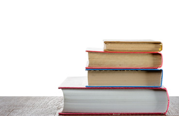 Stack of books on the table with isolated background