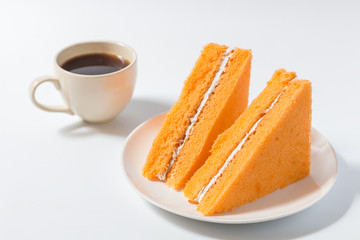 Orange chiffon cake on white background