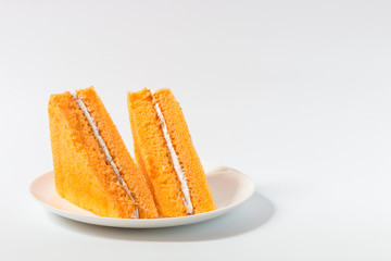 Orange chiffon cake on white background