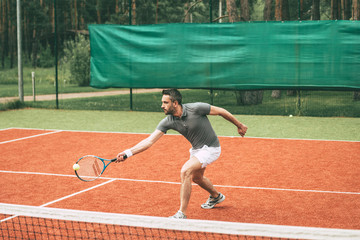 Playing tennis. 