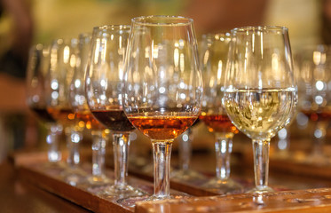 Tasting red and white wine. A tray with glasses. Closeup
