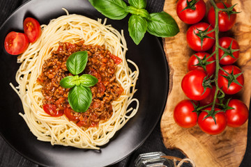 Spaghetti bolognese on dark background