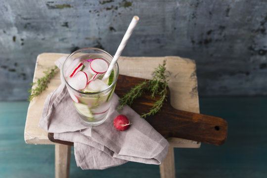 Water with thyme, cucumber and red radish, ice-cooled