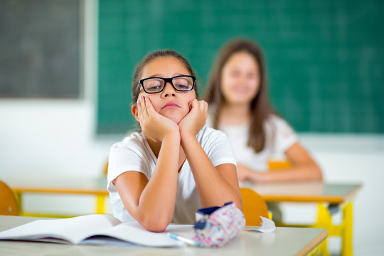 The Little Girl Is Bored In The Classroom