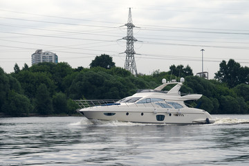 White beautiful boat floats on the river