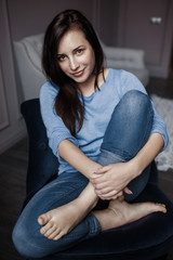 brunette posing in a hotel room