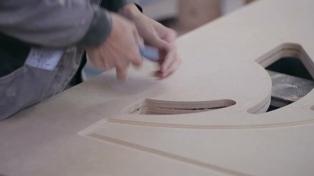 Professional carpenter polish wooden board surface. Close up. 1080p.