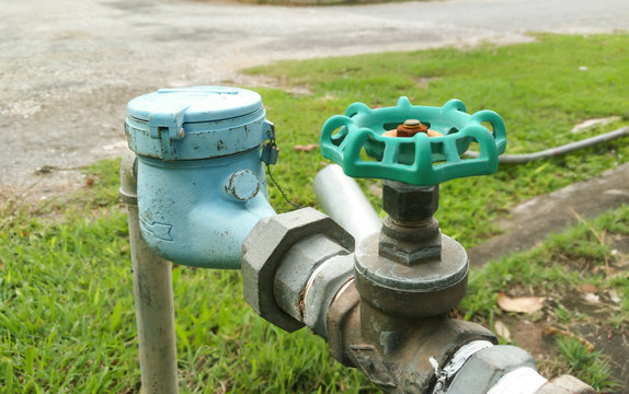 Old water valve of brass mounted connect with water meter