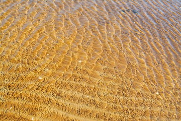 Sea water and sandy bottom