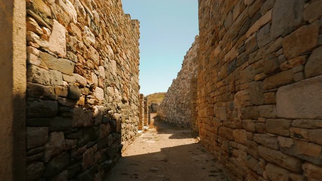 Walking through an ancient street in the Greek island of Delos
