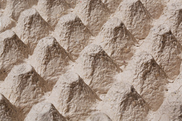 Texture of mountains in the close-up picture of cardboard tray for eggs.