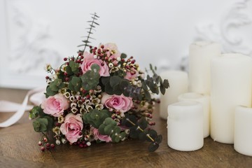 Wedding bouquet near candles