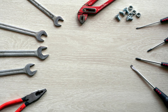 Mechanic tools with wooden background. Top view with copy space