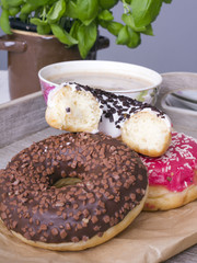 coffee and donut on wood background