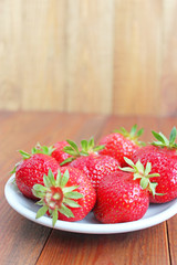 ripe red strawberries on the plate