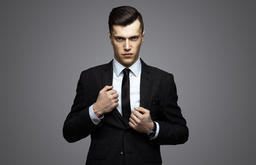 Stylish young man in suit and tie. Business style. Fashionable image. Office worker. Sexy man...