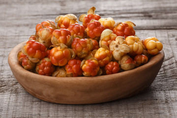 Wooden bowl of Cloudberries