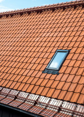 Tile roof and attic window. 