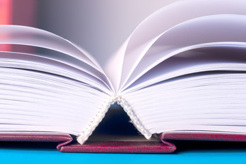 Open book on light table. Back to school. Copy space