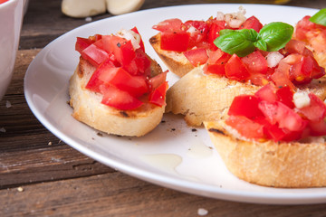 Bruschetta with tomato, onion and basil