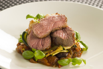Lamb rump with Borlotti beans, confit tomato ragout 

