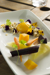 Heirloom carrots with confit egg yolk, hazelnut nasturtium crumble 
