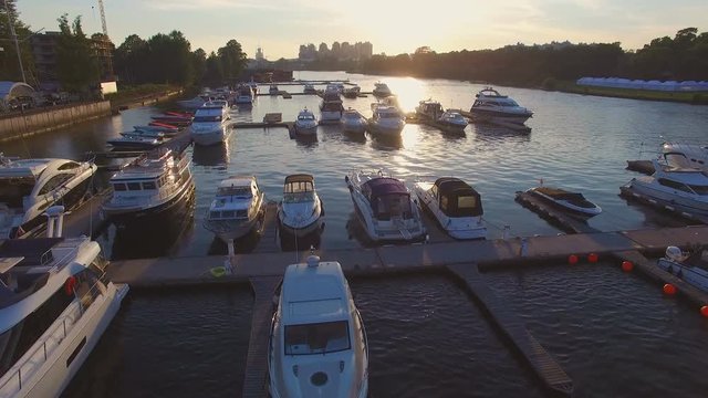 Aerial view of marina full yachts and boats at sunset