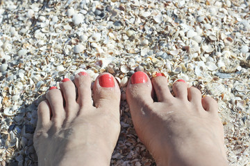 Barefoot feet on sand coast