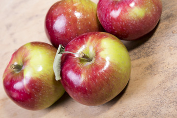 Fototapeta na wymiar tasty apples on a wooden background