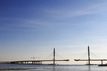 construction of bridge at sunset