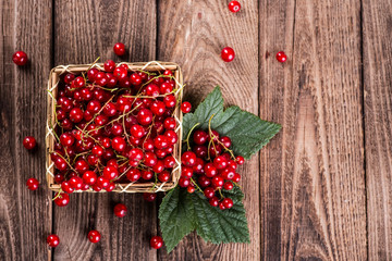 Fresh currants on wooden background