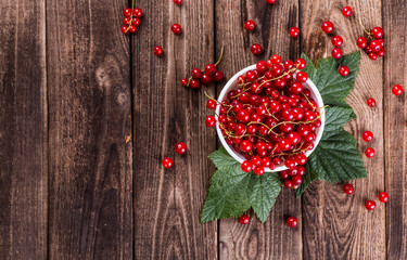Fresh currants on wooden background