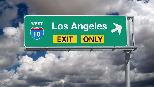 Los Angeles Interstate 10 exit sign with time lapse clouds.
