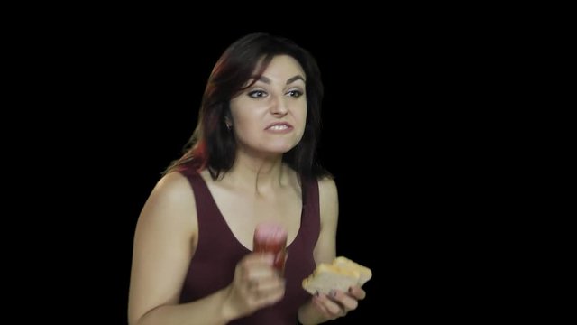 Woman Eats Sausage woman eating a sausage with bread, not healthy food, healthy lifestyle Breaking, alpha channel