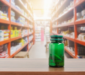 Pill bottle on table with pharmacy store