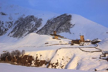Evening light and ancient georgian buildings in Ushguli