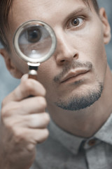 Man with magnifying glass