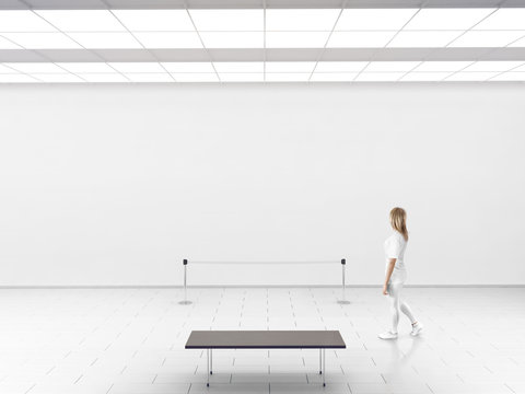 Modern gallery wall mockup. Woman walk in museum hall with blank wal, fence, bench. White clear stand mock up show. Display artwork presentation. Art design empty floor. Expo studio wall in center.