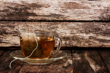 Herb tea. Tea bag in a transparent cup with boiling water