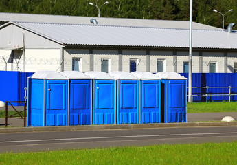 Blue toilets  on a city street