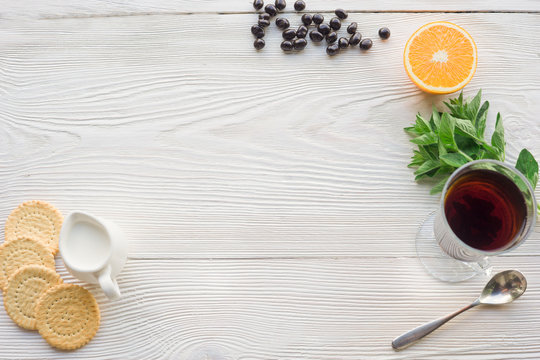 Top view of fruit tea on wooden plank table