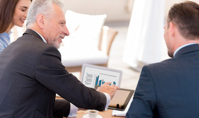 Positive colleagues sitting at the table