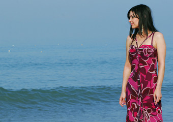 young woman on the sea in summer 