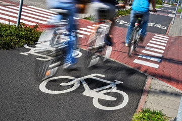Bicycle road sign and bike riders