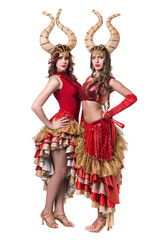 Two women dancers with horns. Isolated on white background.