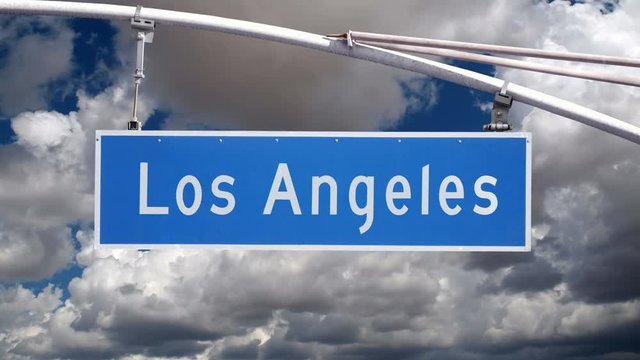 Los Angeles Street sign with time lapse clouds in Southern California.