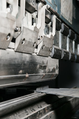 operator bending metal sheet by sheet bending machine
