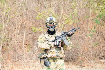 Fototapeta premium Portrait of men in action Airsoft gun.